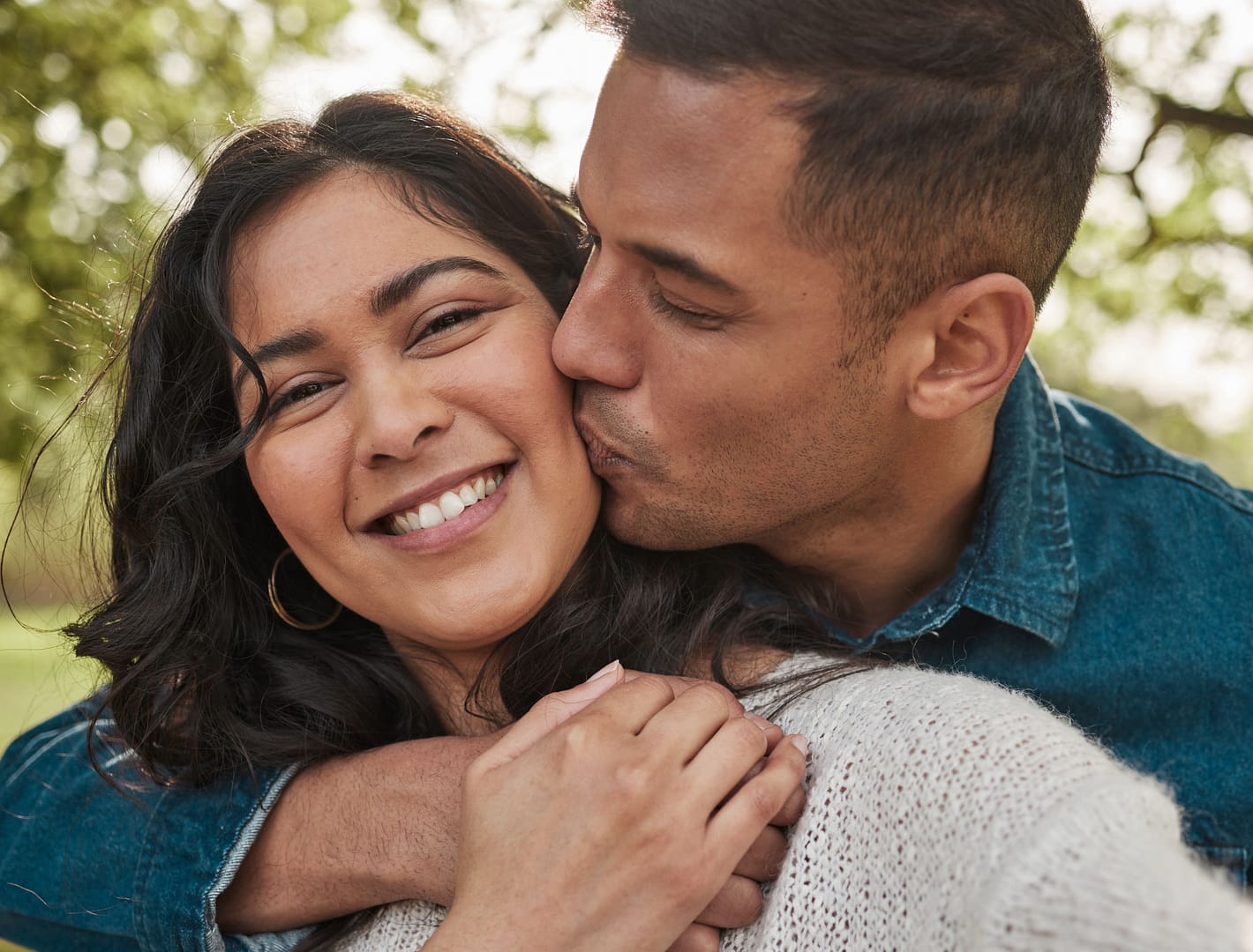 ethnic couple hugging