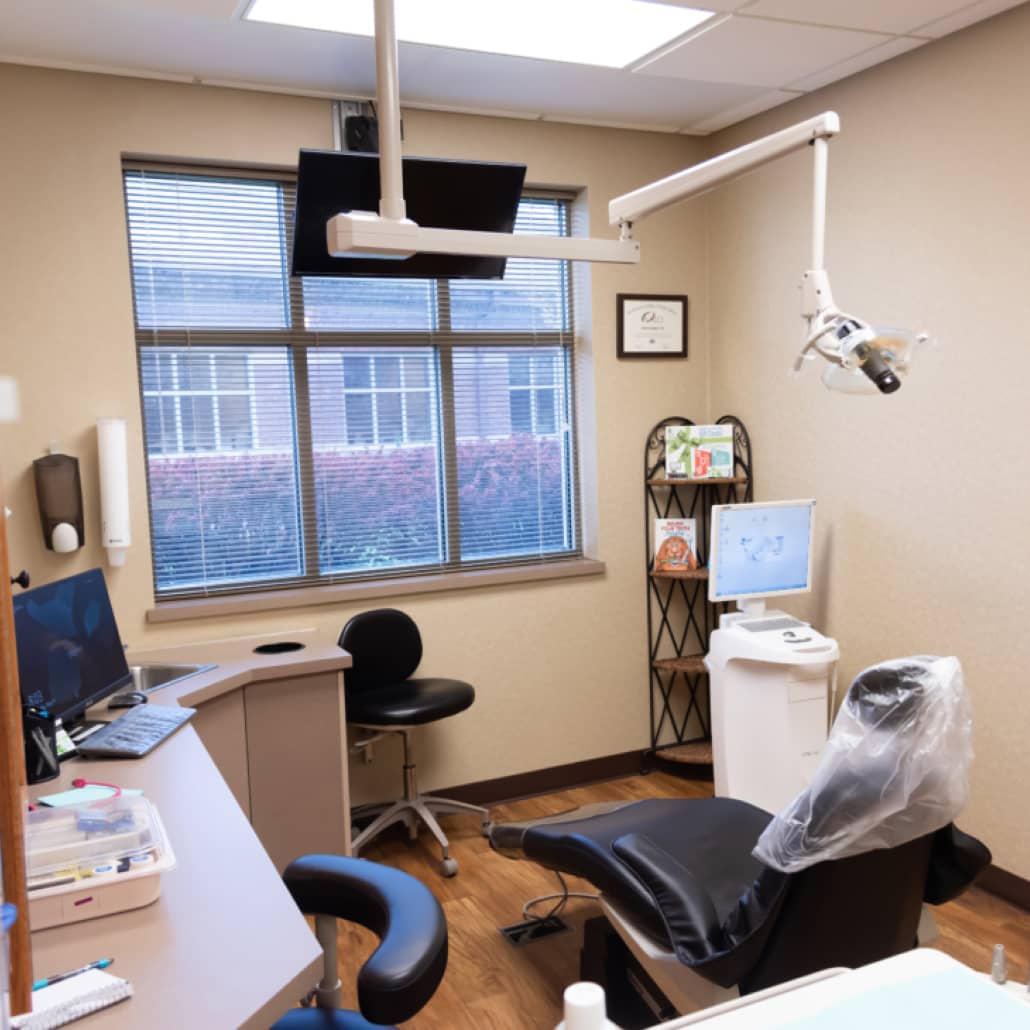 exam room with dental chair and equipment