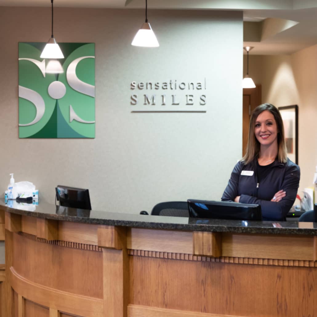 team member behind front desk