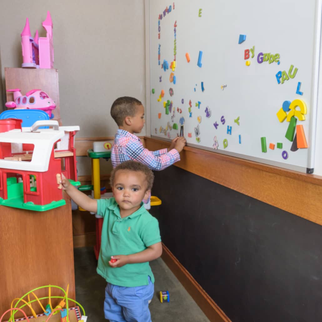 two children playing in the children's area