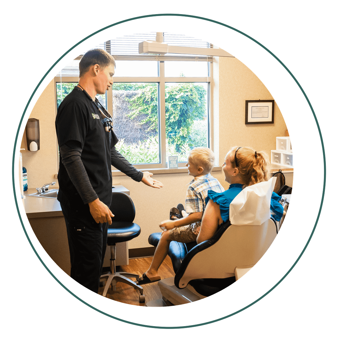 Dr. Swingdorf with pediatric patient and mother