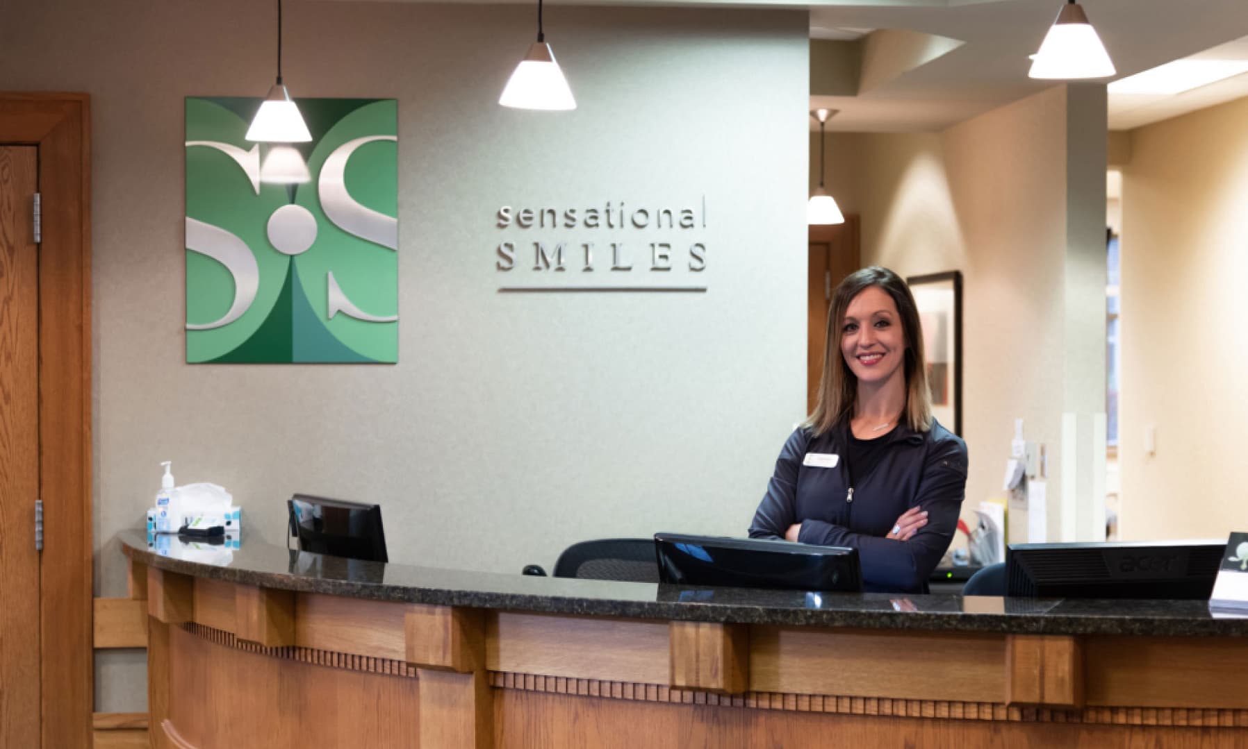 welcome team member at front desk