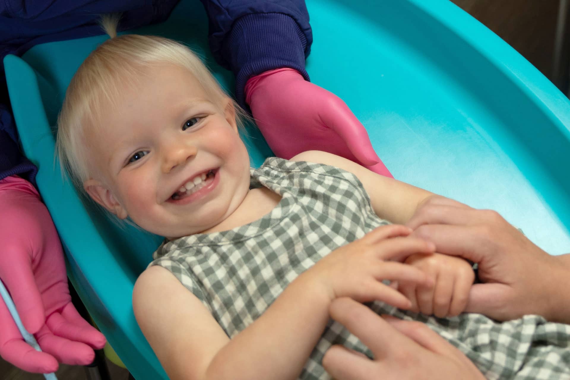 smiling female toddler patient having dental exam