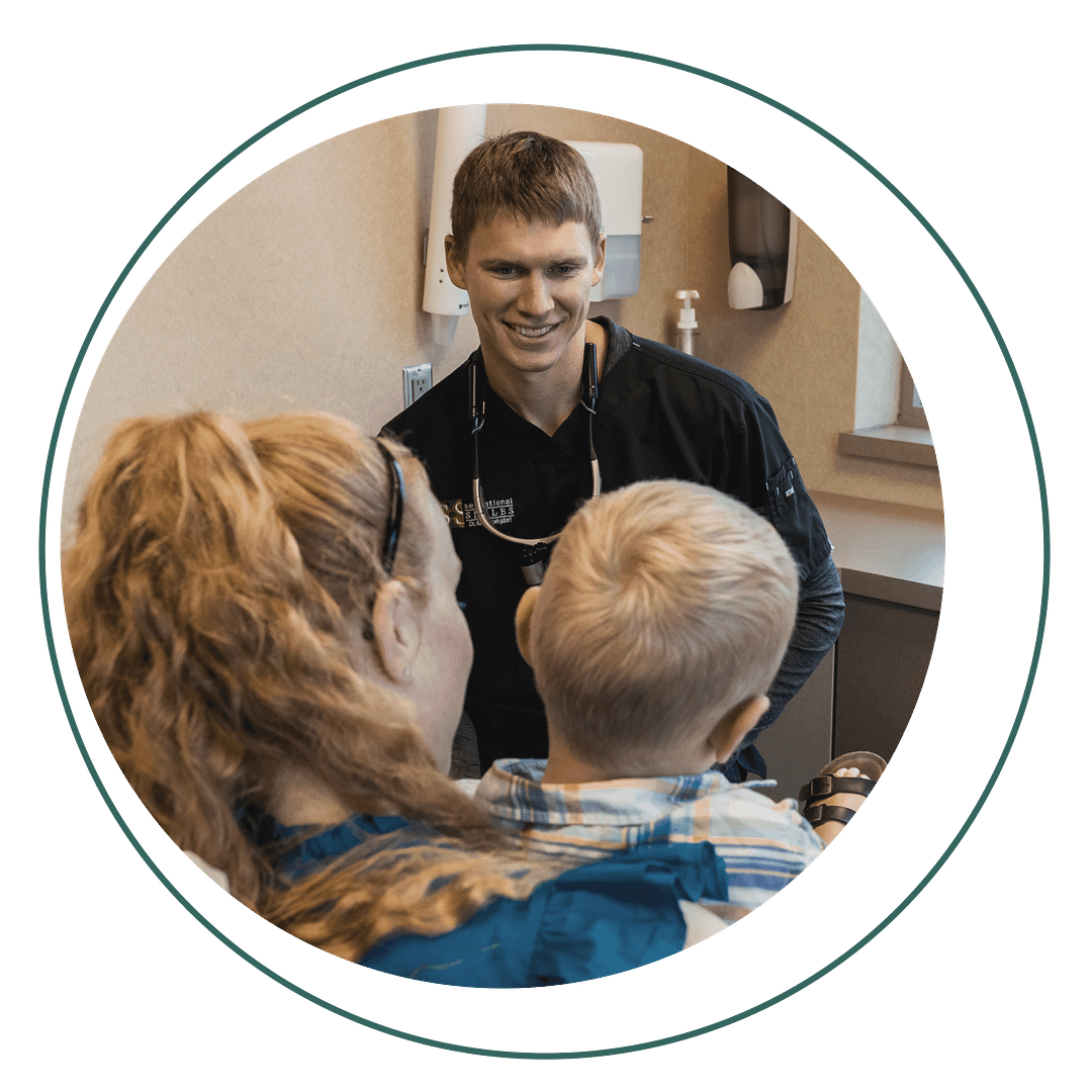 pulpotomy Dr. Swingdorf with pediatric patient and mom in exam room