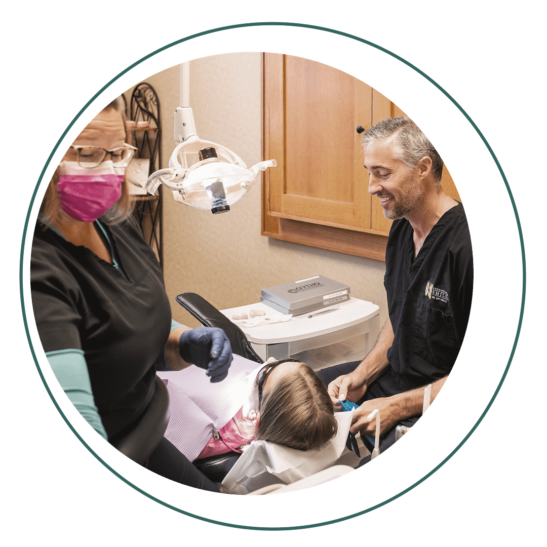 fluoride Dr. Frieock and assistant with pediatric patient in exam room