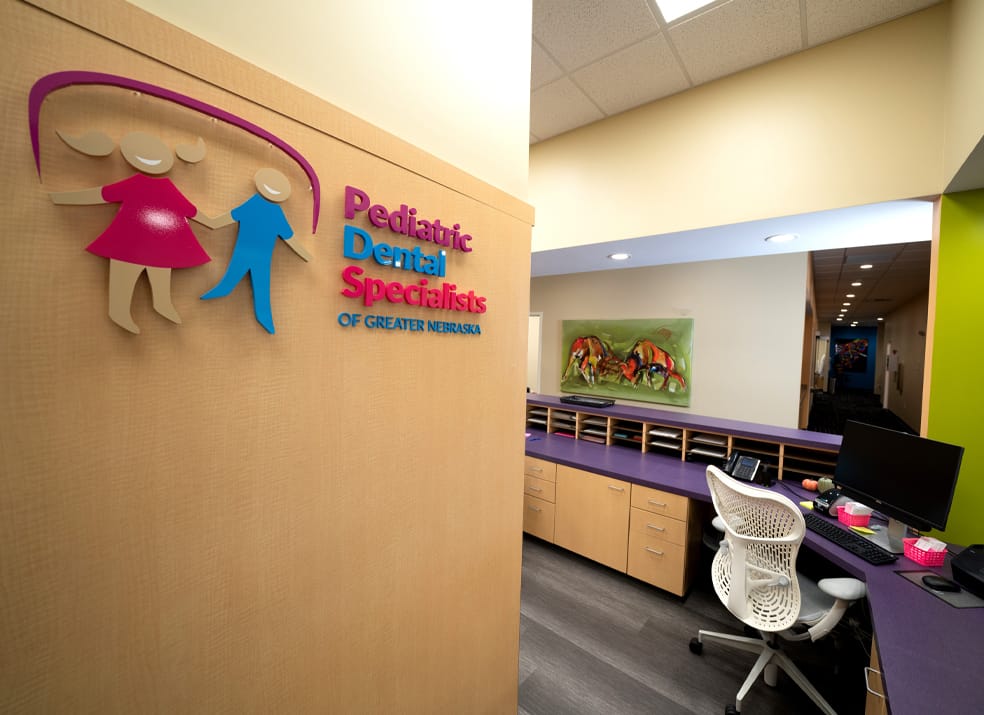 front desk with PDS logo on wall