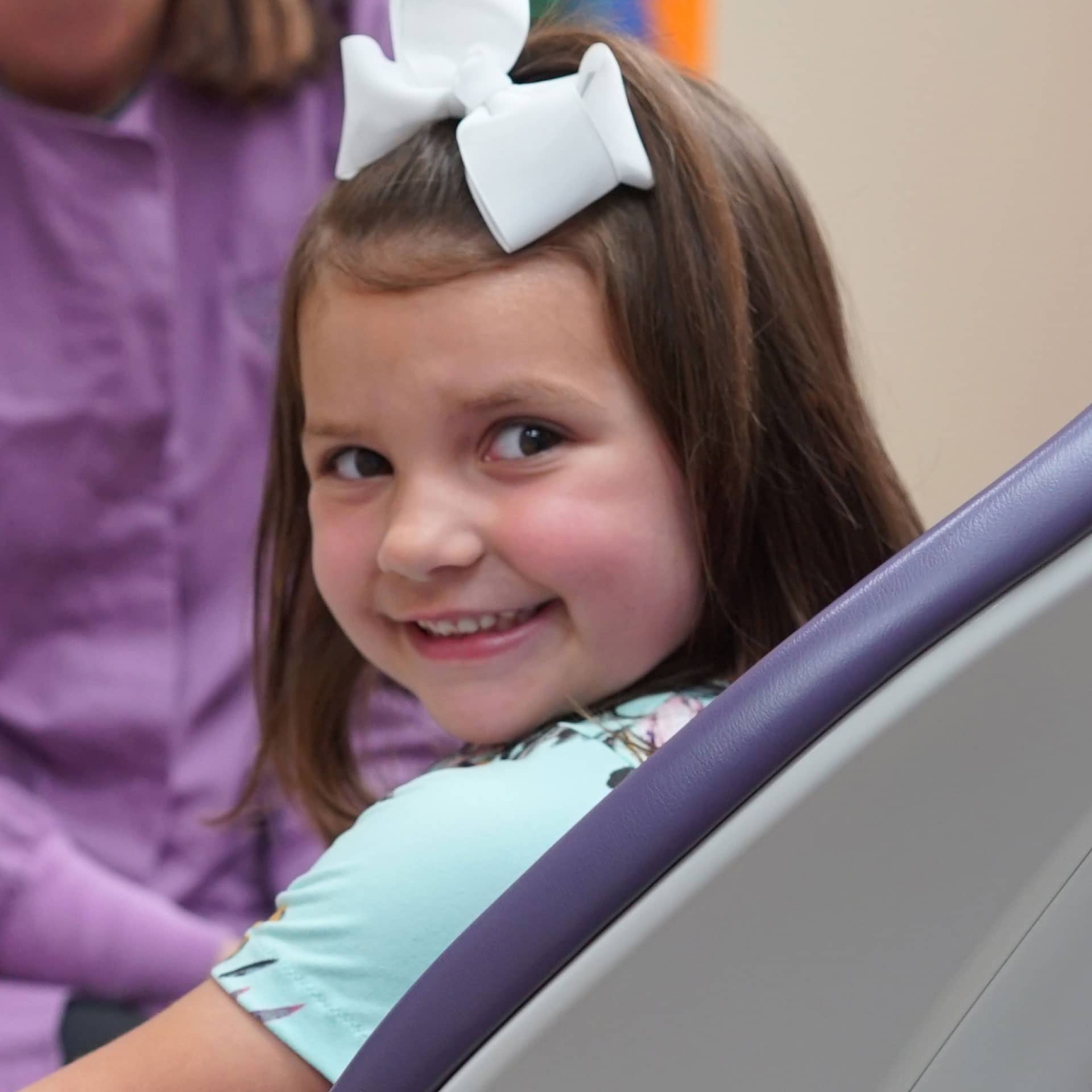 young girl smiling at camera