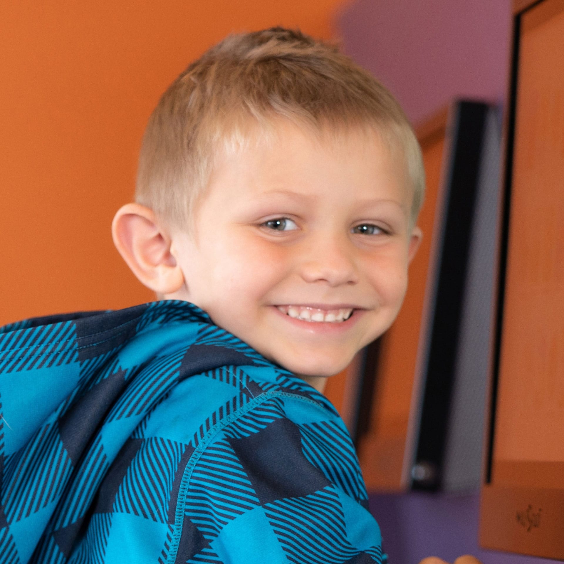 young boy smiling at camera