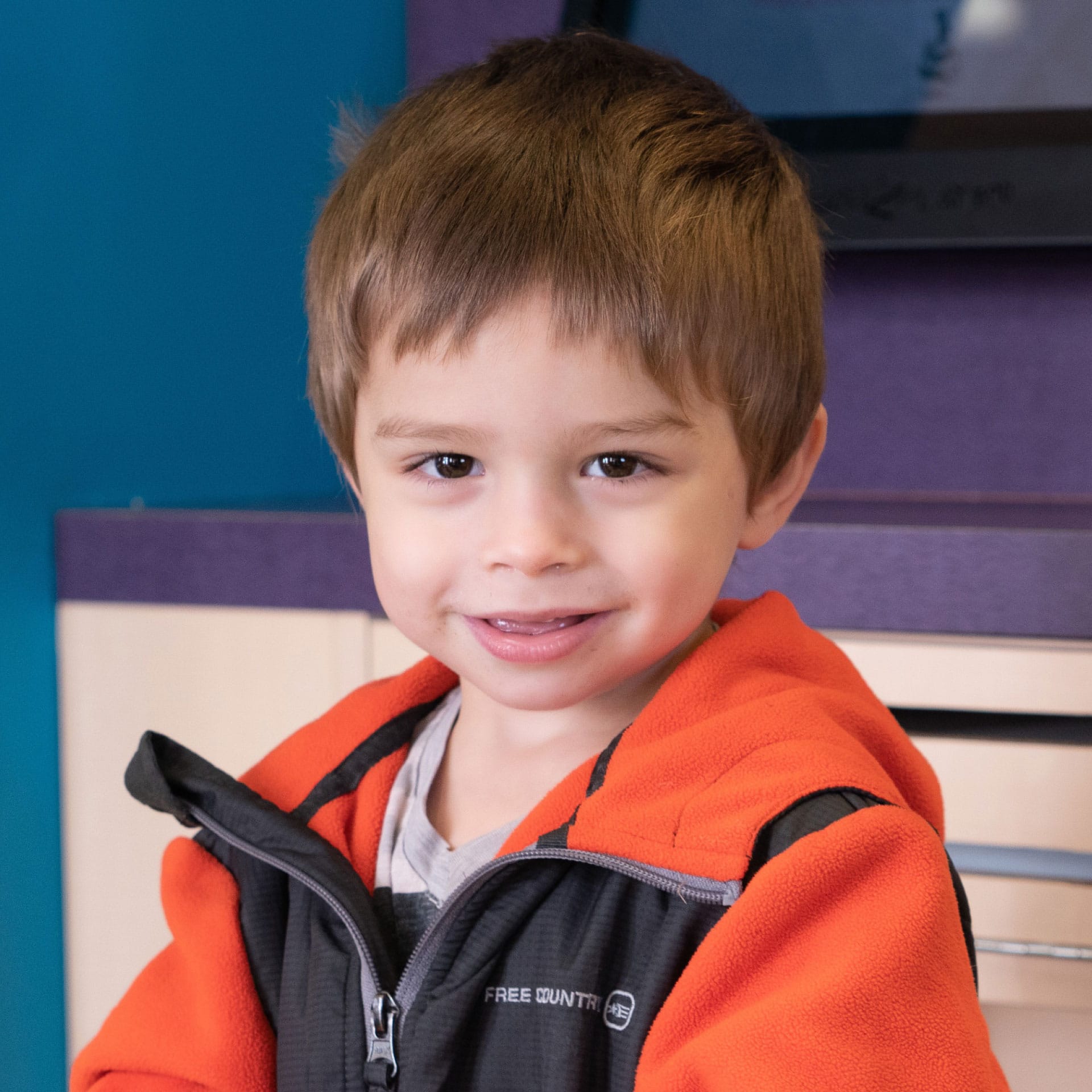 toddler boy smiling at camera