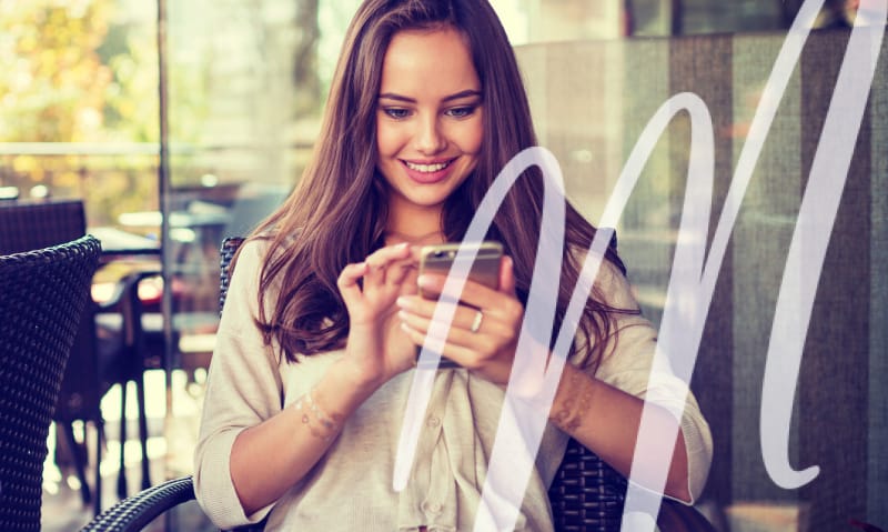 woman excited to be on her phone