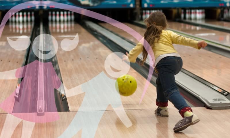 young girl bowling