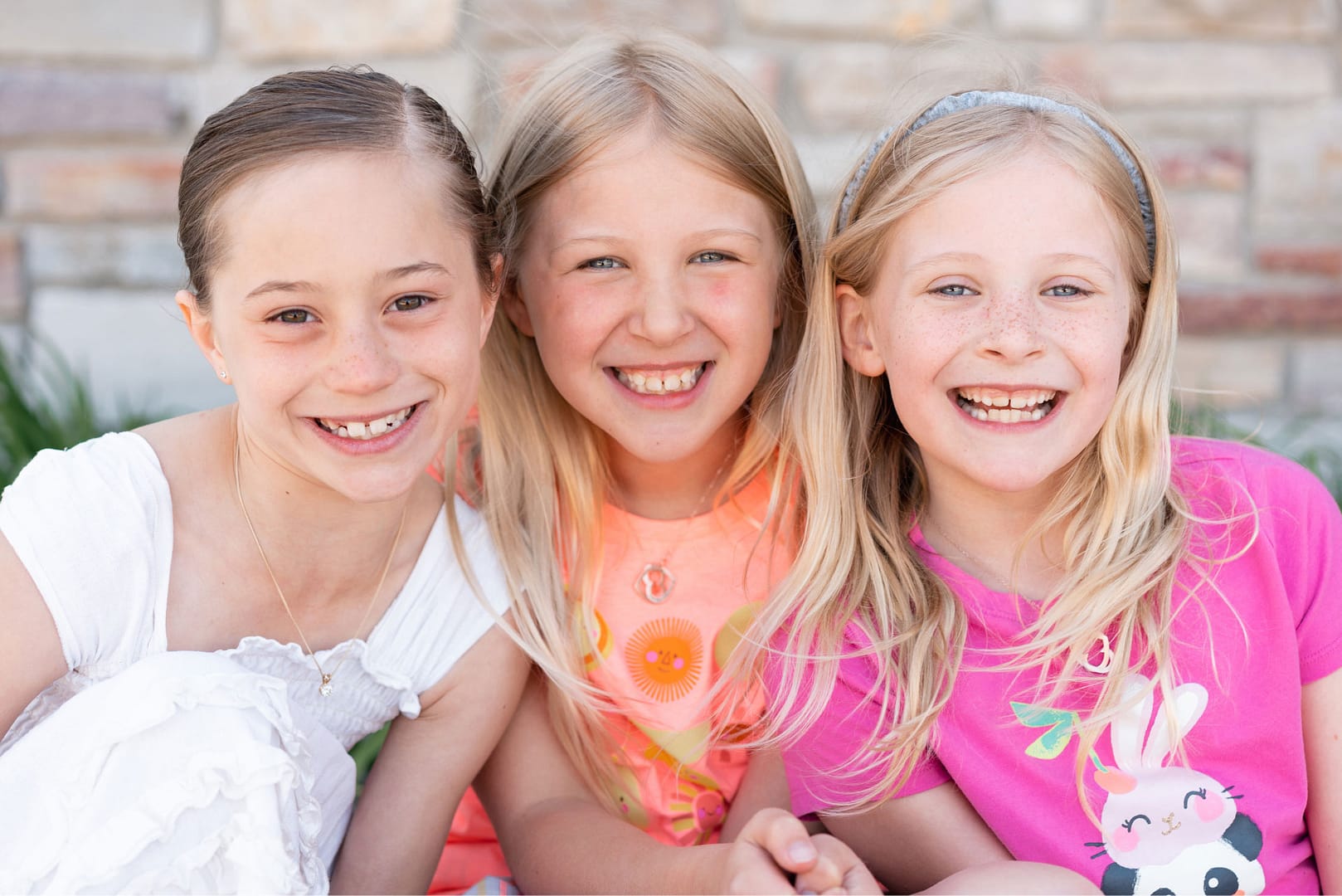 3 female patients smiling
