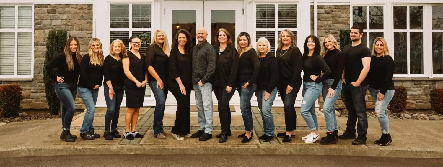 Spinnaker Pediatric Dentistry team posing in front of office building