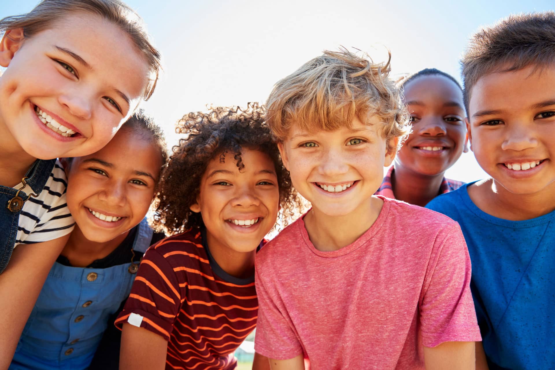 group of kids smiling at camera