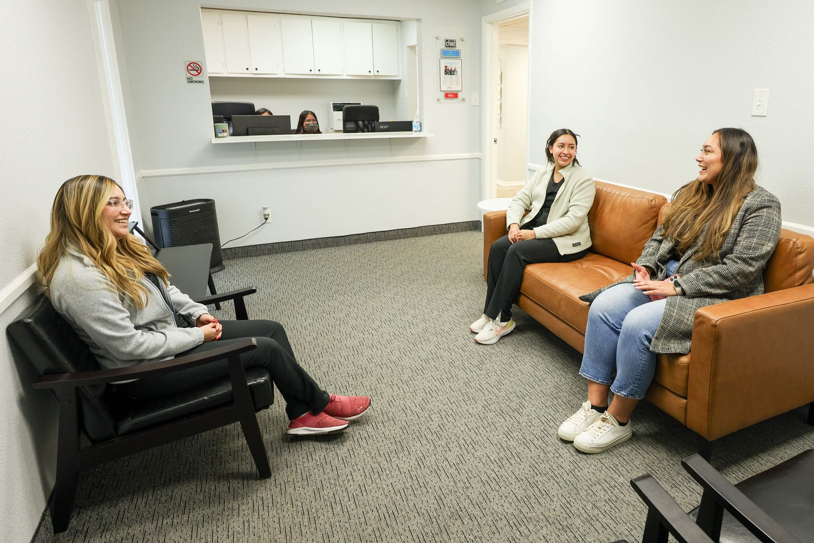 welcome patients in reception area near front desk
