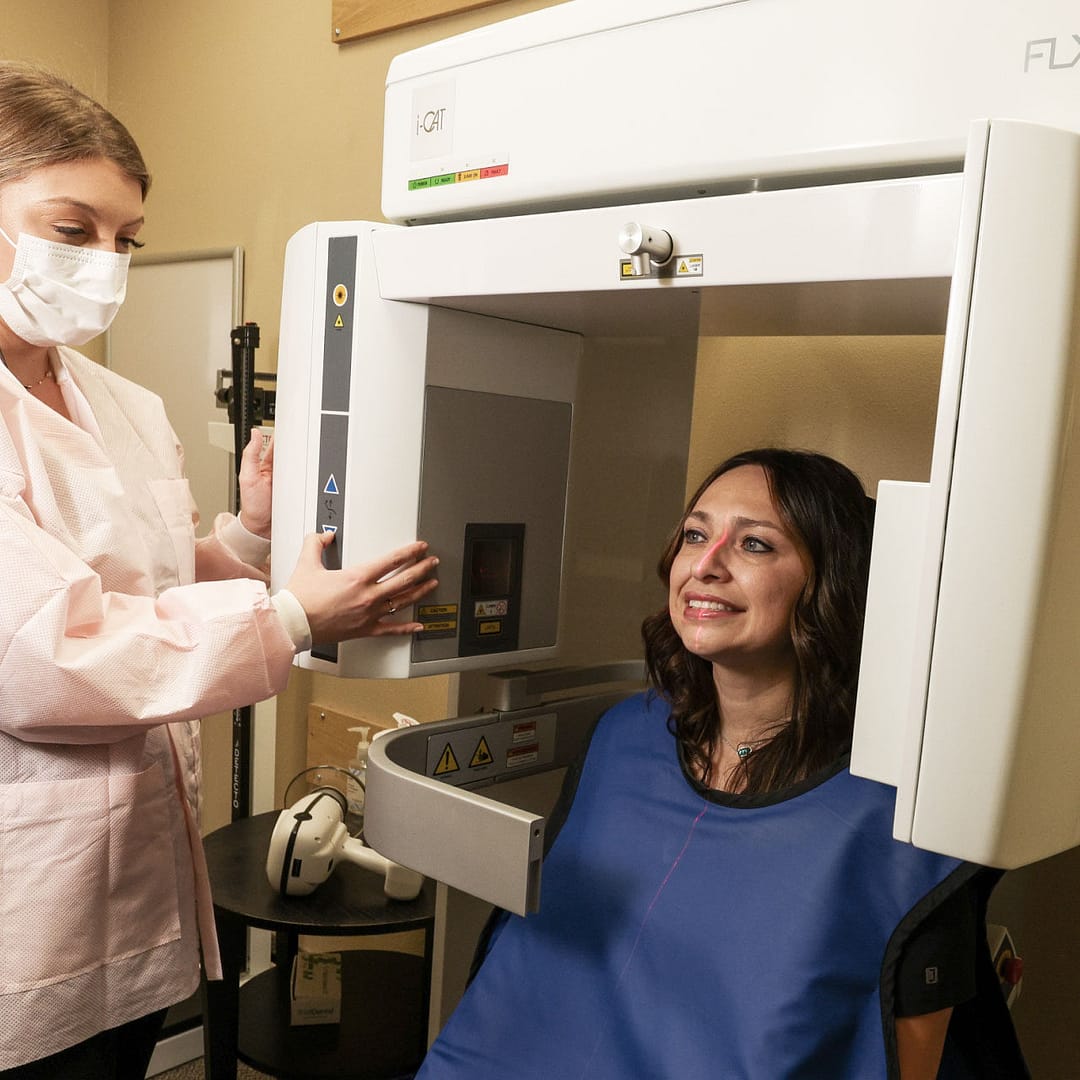 team member taking xrays of patient