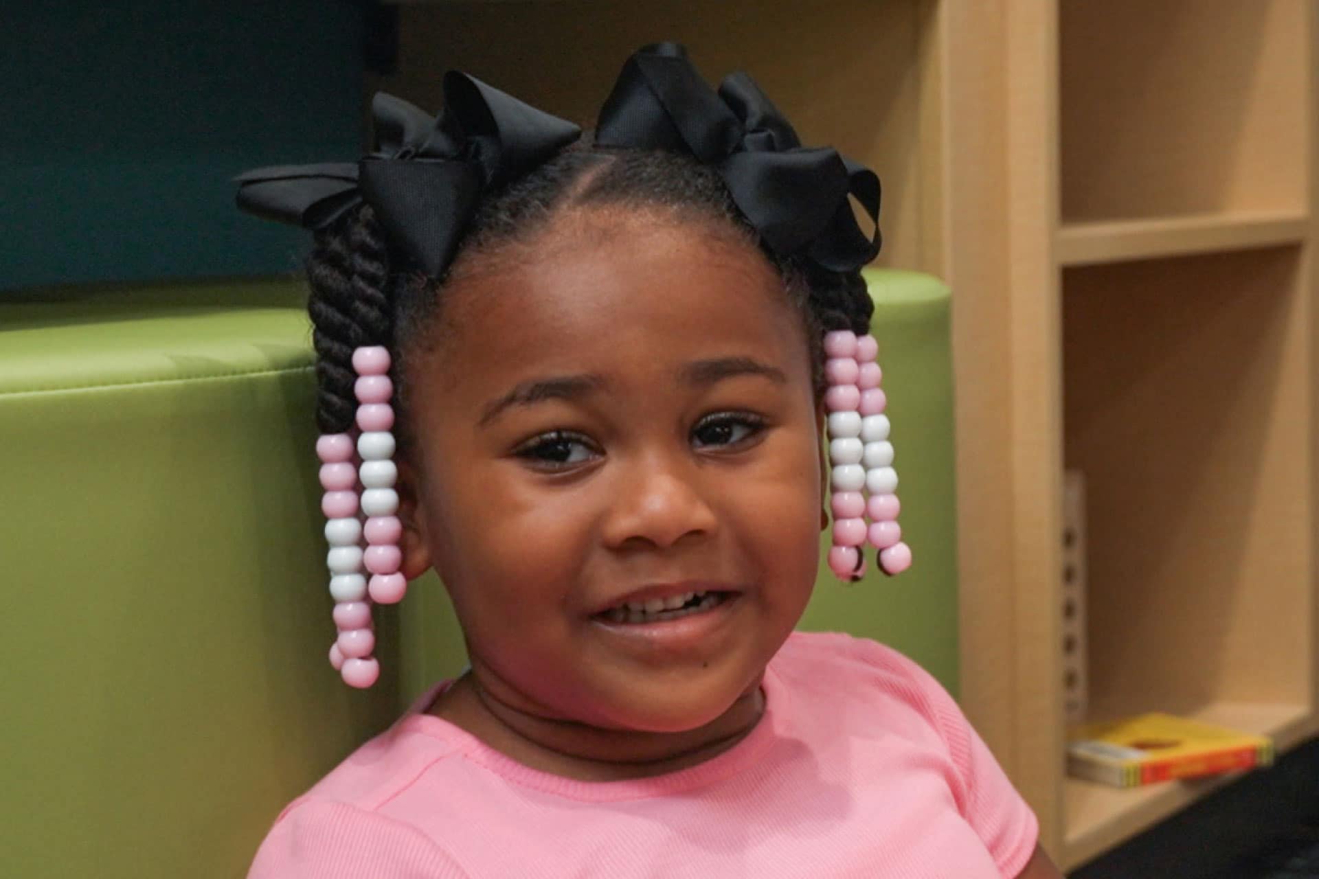 african american pediatric patient smiling at camera