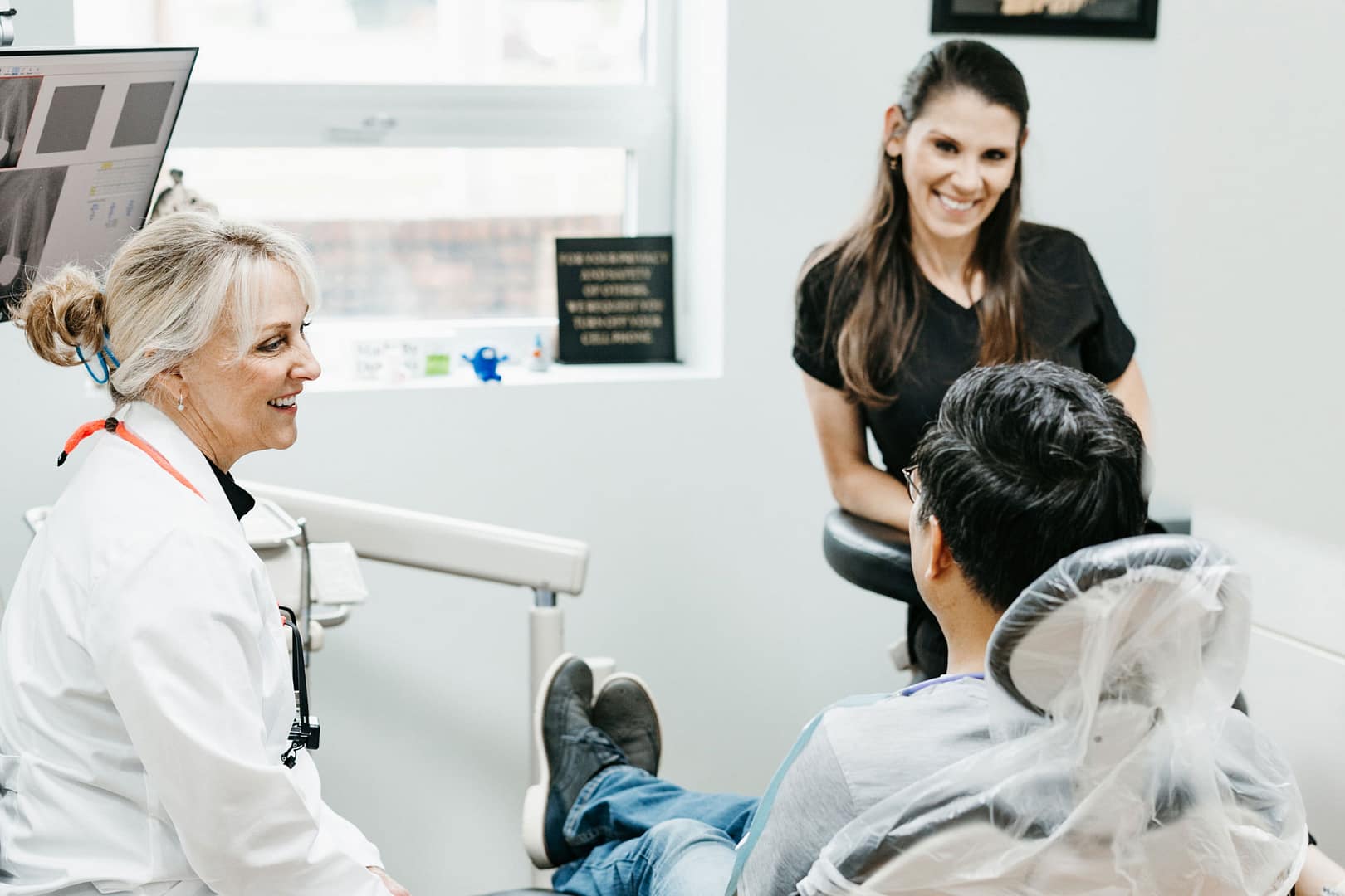 Dr. Corbett and assistant talking with patient