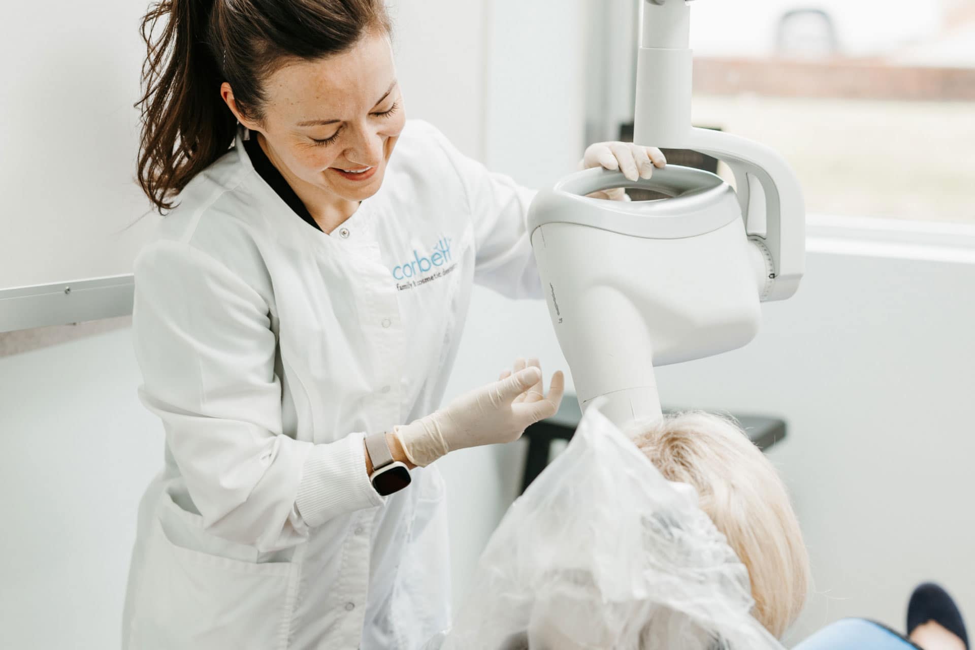 team member taking intraoral photos of patient