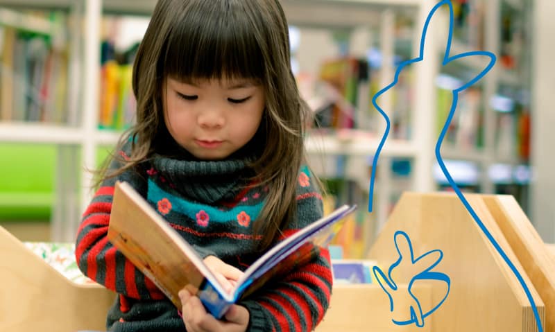 pediatric patient reading a book