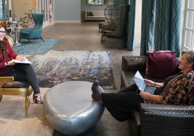 Dru Halverson meeting with team member