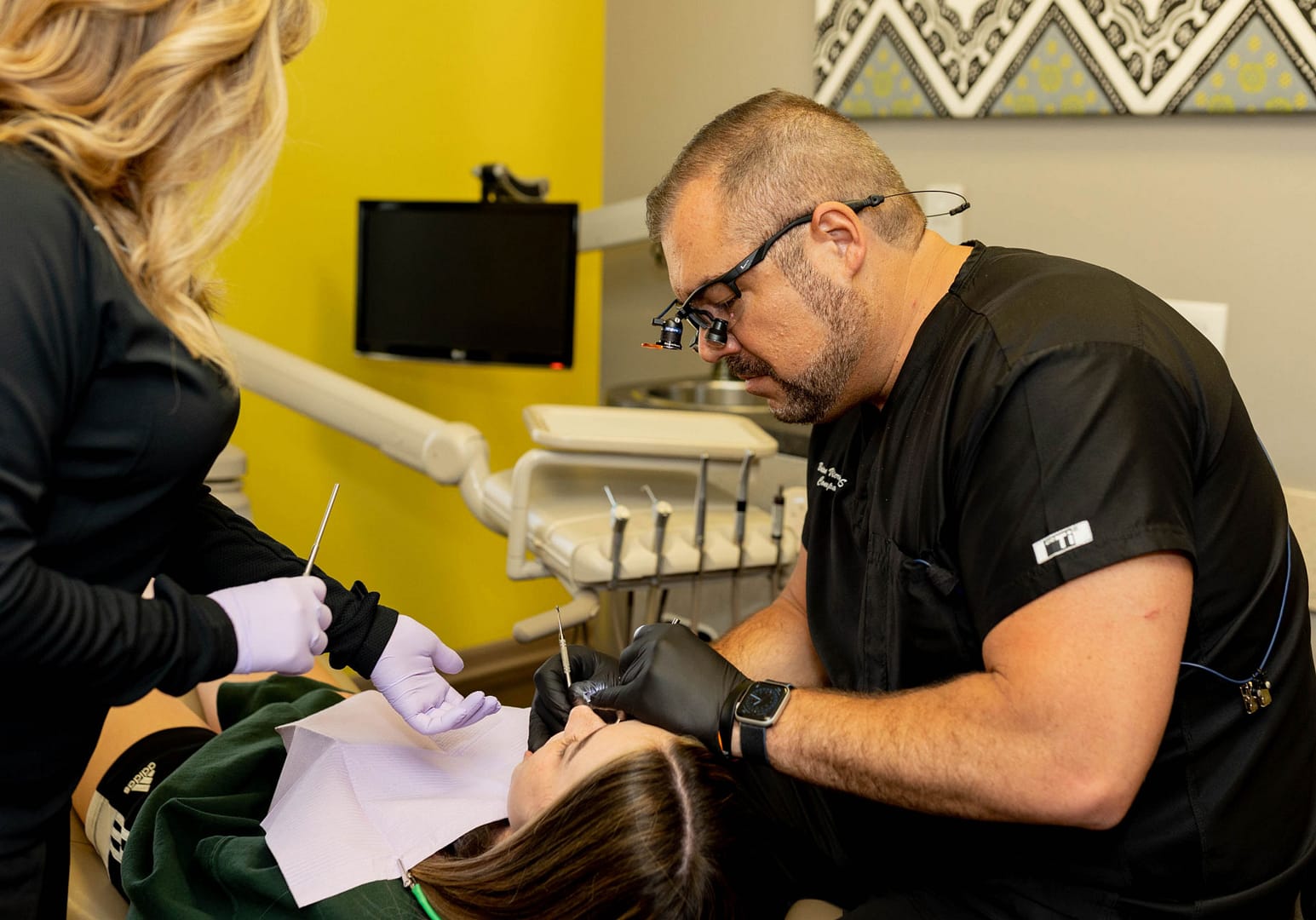 ortho-home-feature-new doctor working on patient