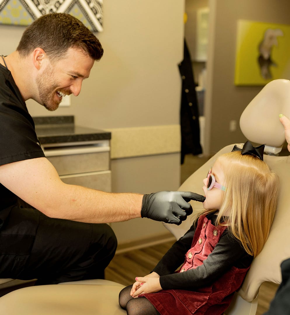 doctor checking young patient