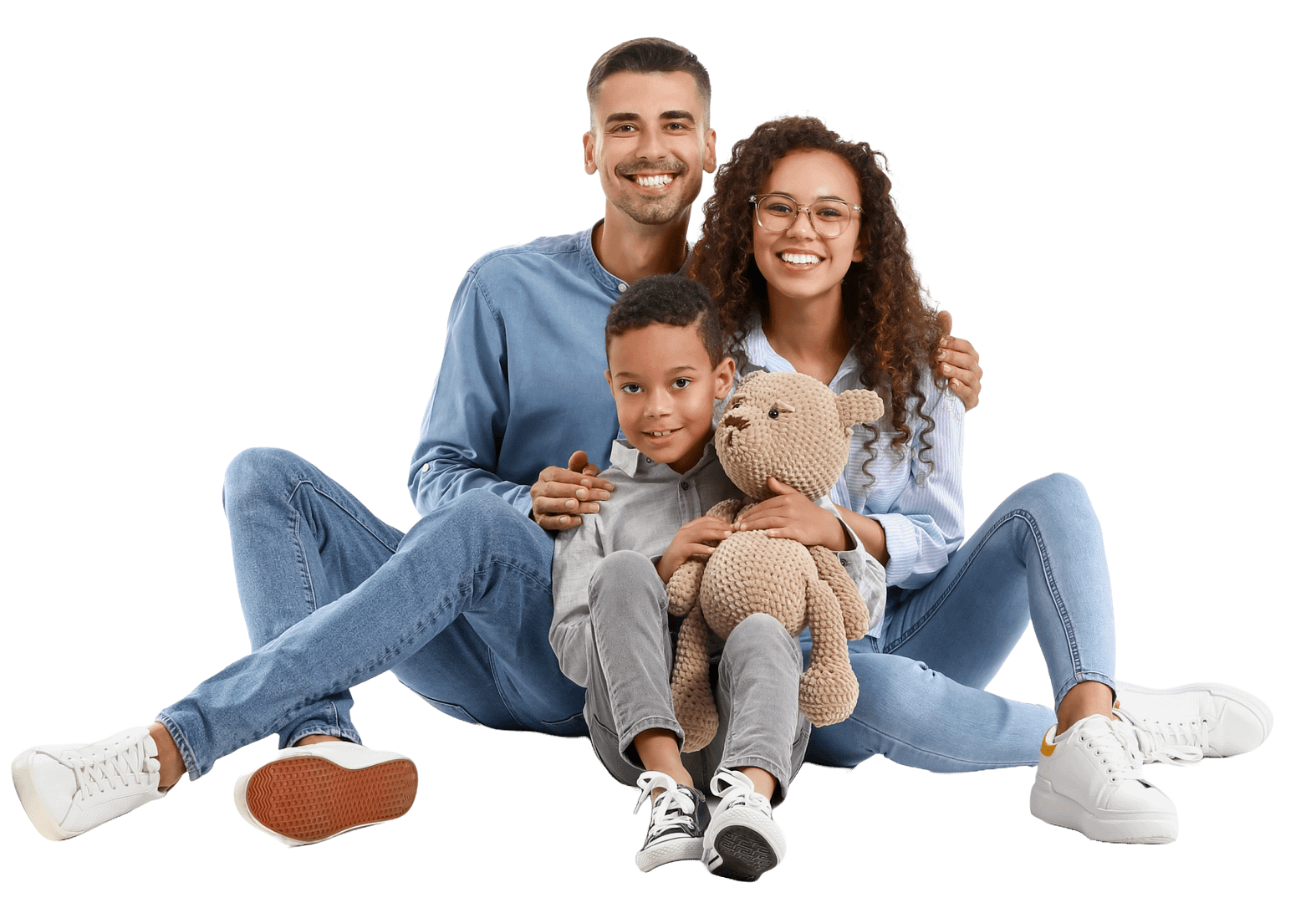 mixed race family of 3 with little boy holding teddy bear