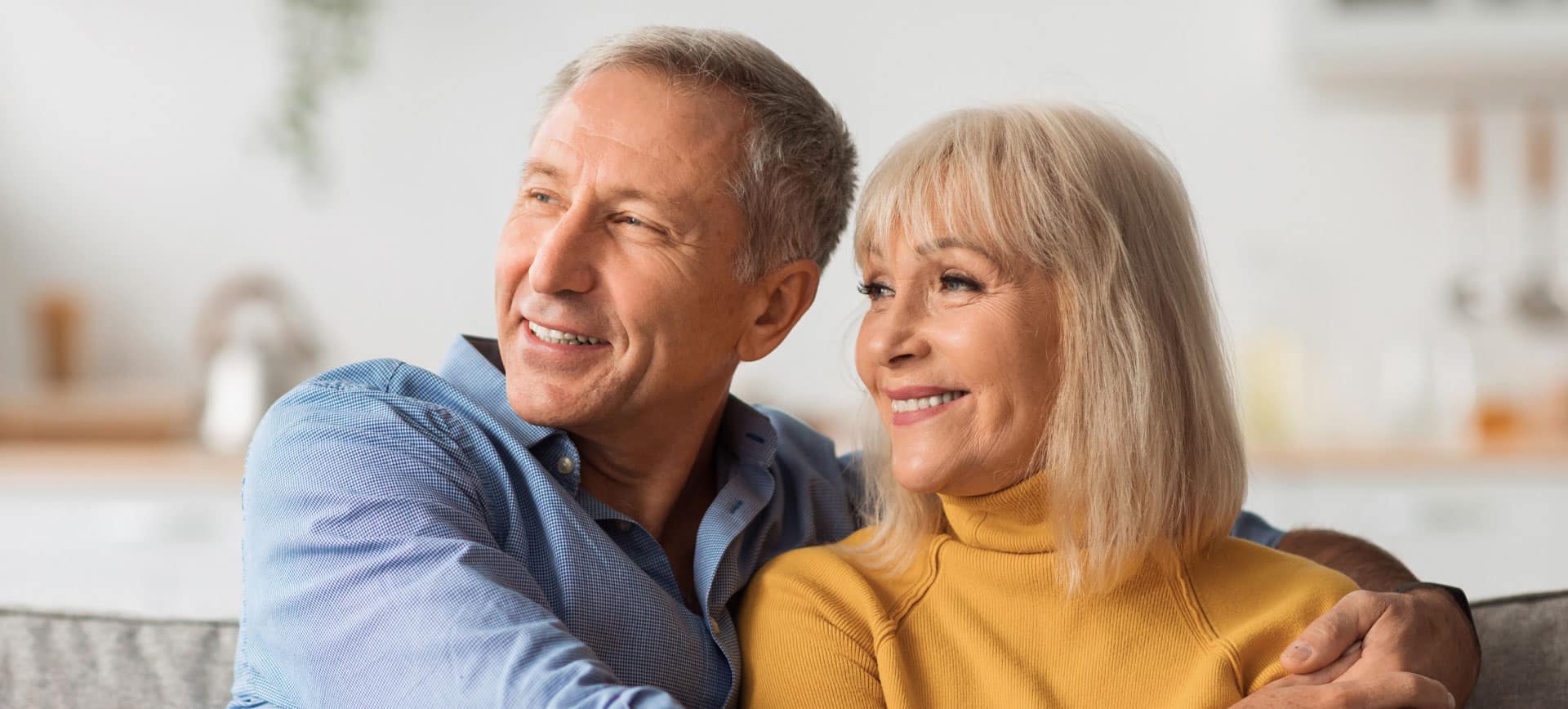 older couple sitting on couch