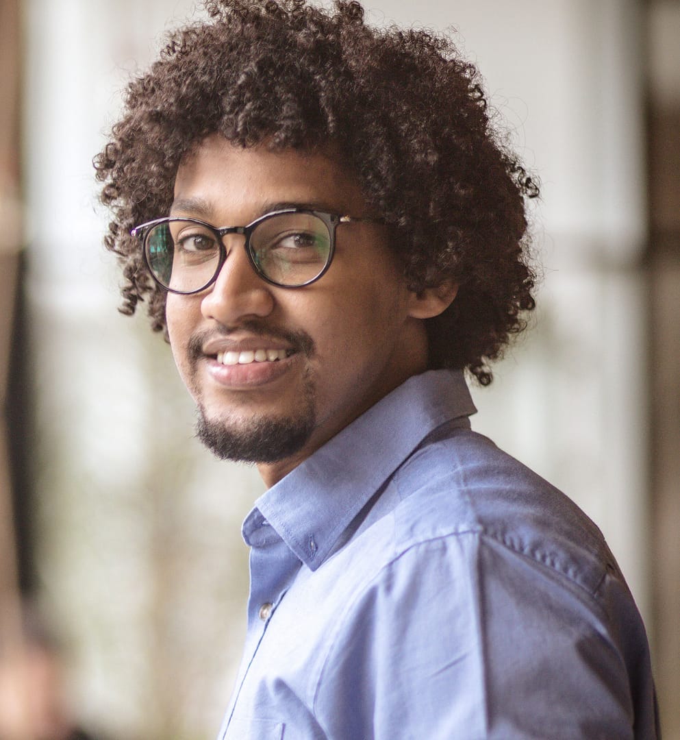african american male smiling and wearing glasses