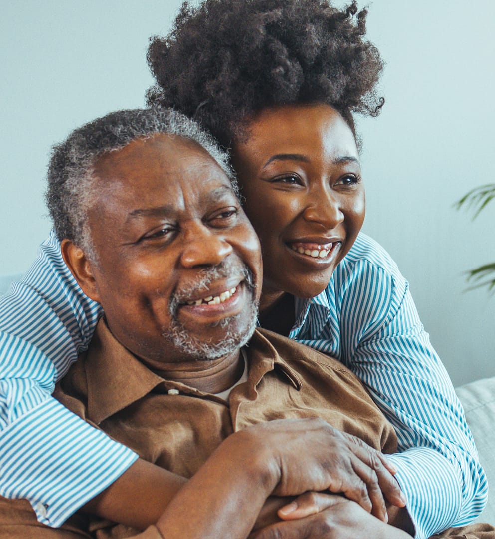 african american daughter hugging father