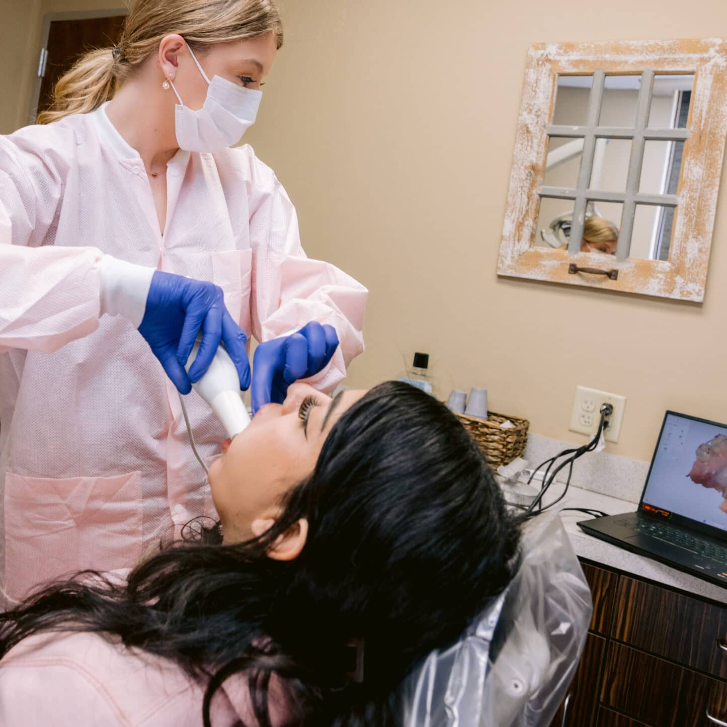 ortho-home-feature-main team member taking intraoral photos of patient
