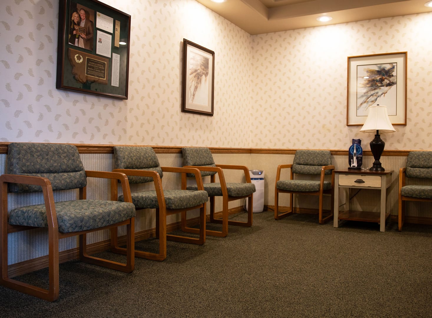 reception area with green printed chairs