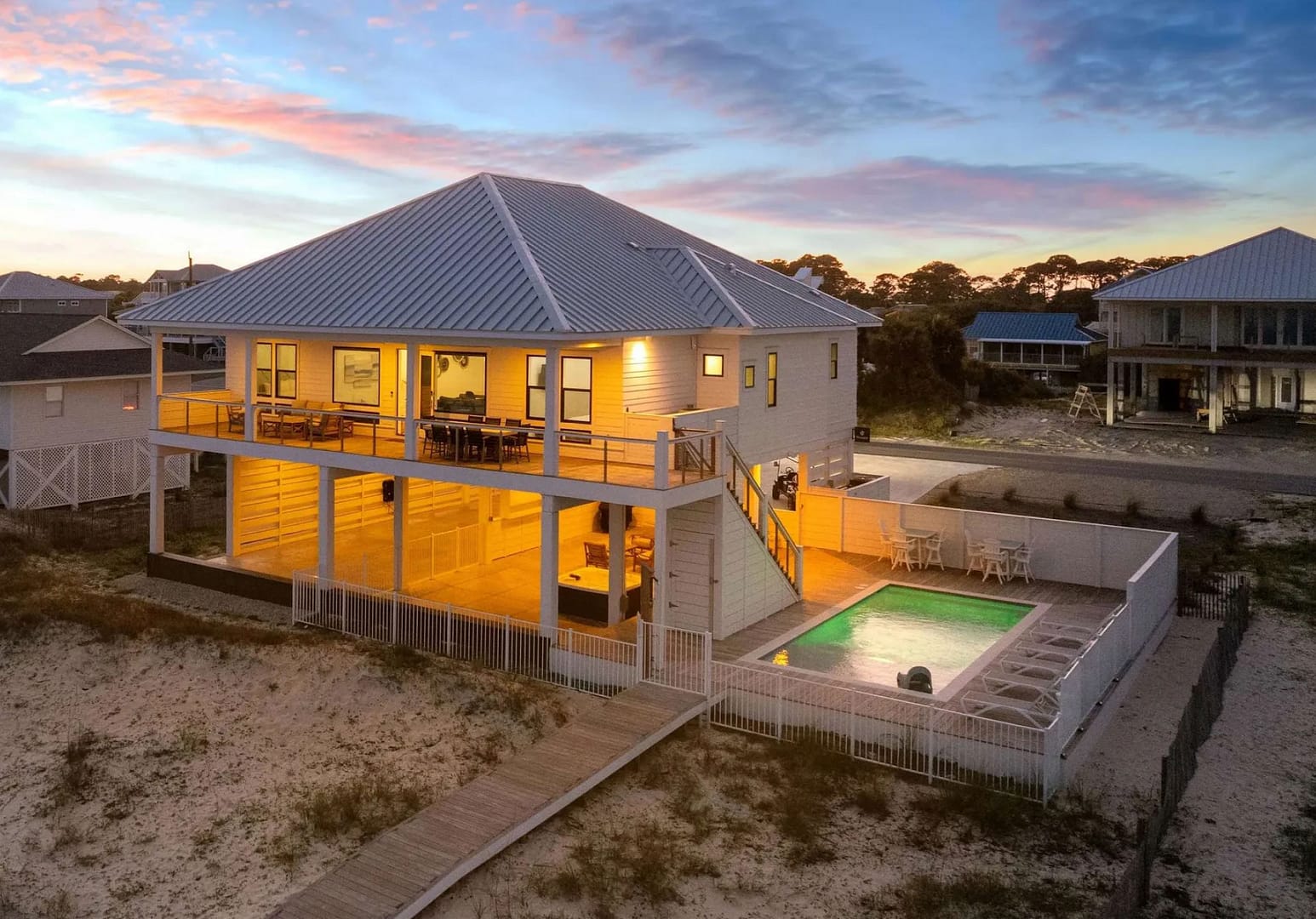 Wander St. George Island exterior with pool at night